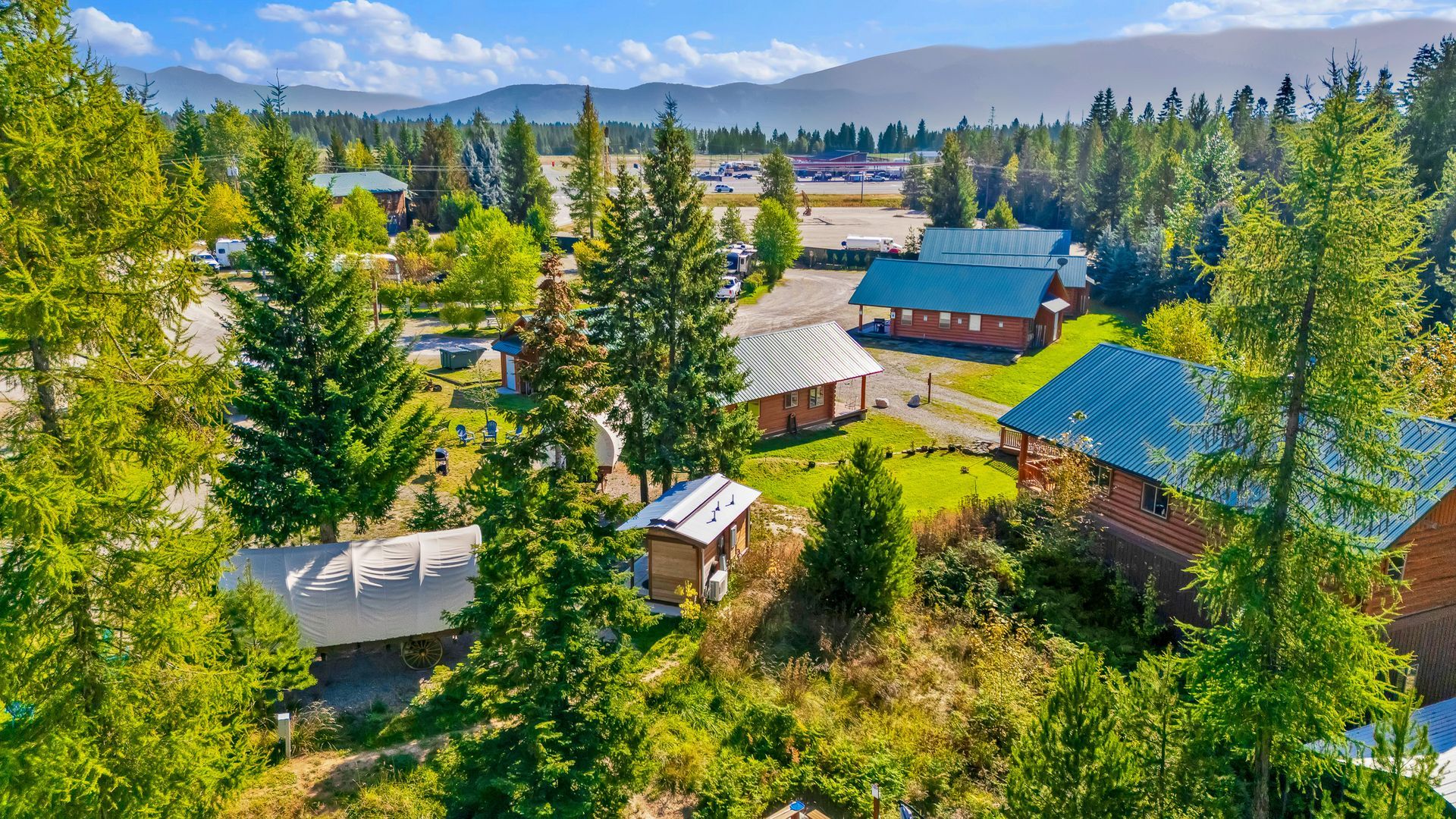 RV sites, luxury log cabins and a glamping campground with water electric sites and full hook up sites next to a pavilion, playground, hot tub, bathhouse in a wooded setting in Bonners Ferry, Idaho in the North Idaho pandhandle