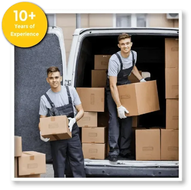 Two men are loading boxes into a van.