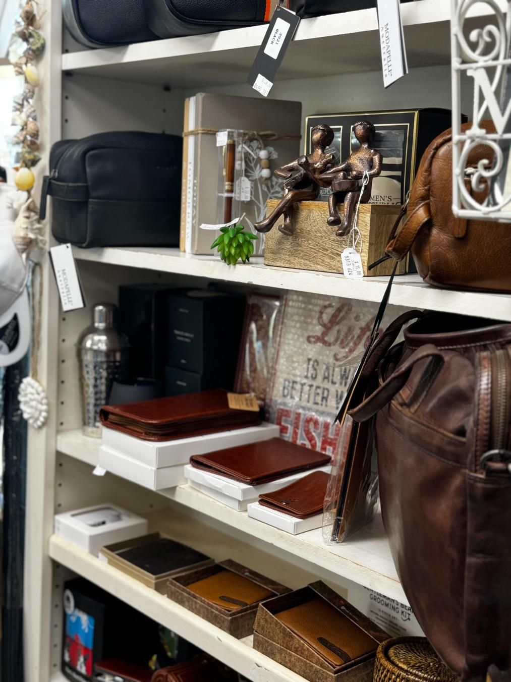 A Store Shelf Filled With Lots Of Bags And Wallets — Beach Time Trading Co In Yeppoon, QLD