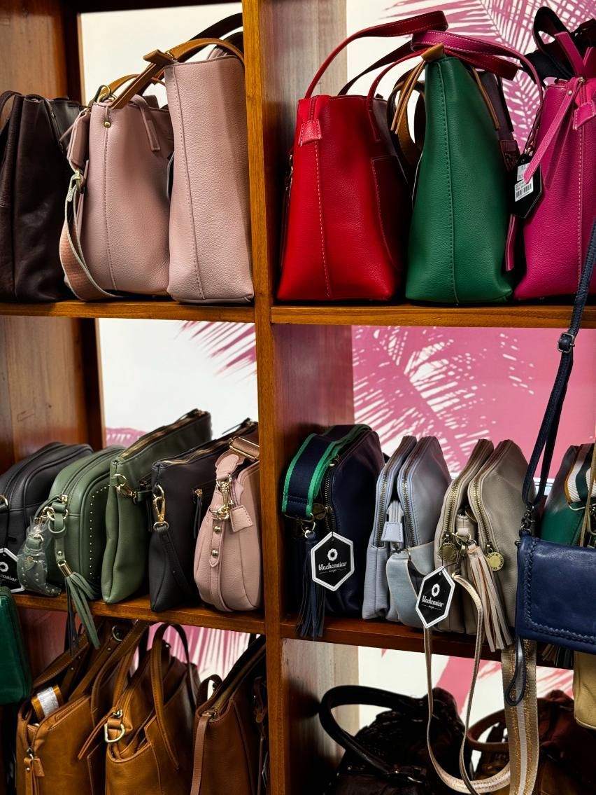 A Shelf Filled With Lots Of Different Colored Handbags — Beach Time Trading Co In Yeppoon, QLD