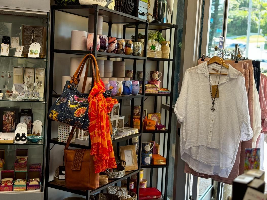 A Store Filled With Lots Of Clothes And Candles — Beach Time Trading Co In Yeppoon, QLD