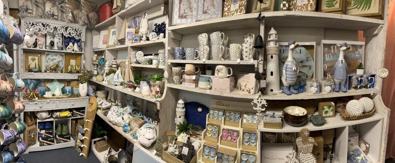 A Room Filled With Shelves Filled With Lots Of Ceramics — Beach Time Trading Co In Yeppoon, QLD