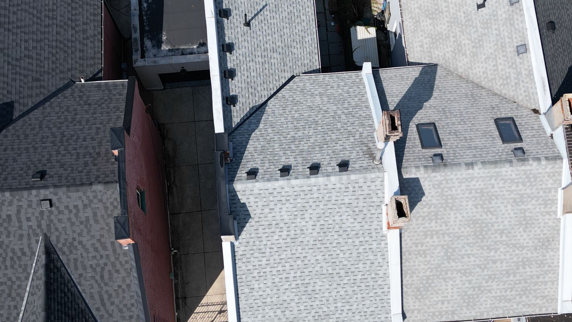 An aerial view of the roofs of a residential area