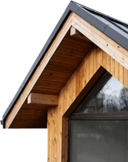 A house with a wooden roof and a large window