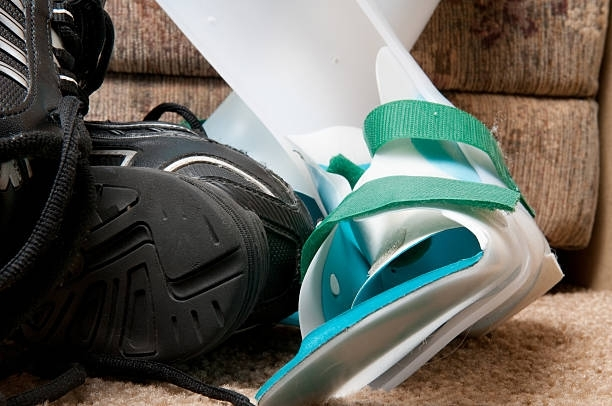 Physiotherapist Applying An Orthosis To A Patient - Crystal River, FL - Kidder Orthopedic Laboratories