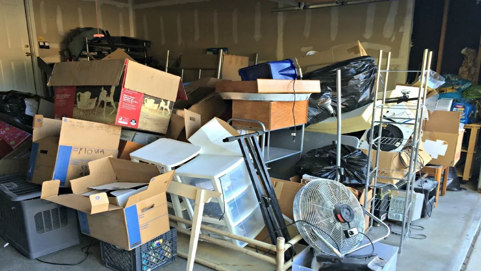 Garage cleanup and junk removal service clearing clutter in Maryland home