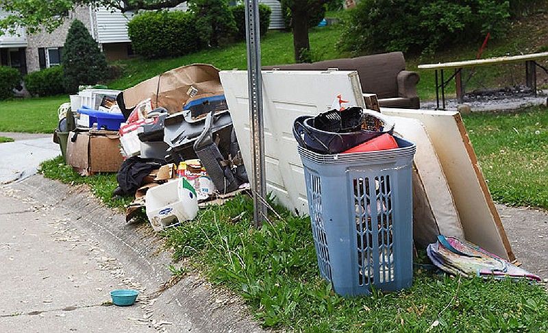 Large household items set out for bulk waste collection service.