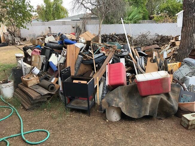 Backyard full of junk and debris ready for professional junk removal service | Junk Haul-Stars