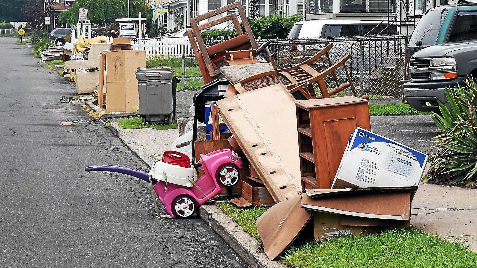Bulk trash items placed on the curb ready for scheduled pickup.