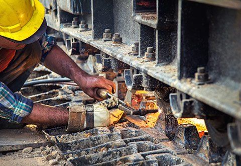 Customized Metal Fabrication — Man Repairing Railway in Navassa, NC