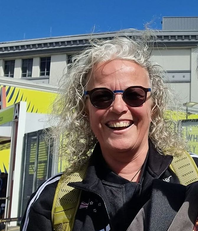 a person in a transformer costume is standing in front of a building .