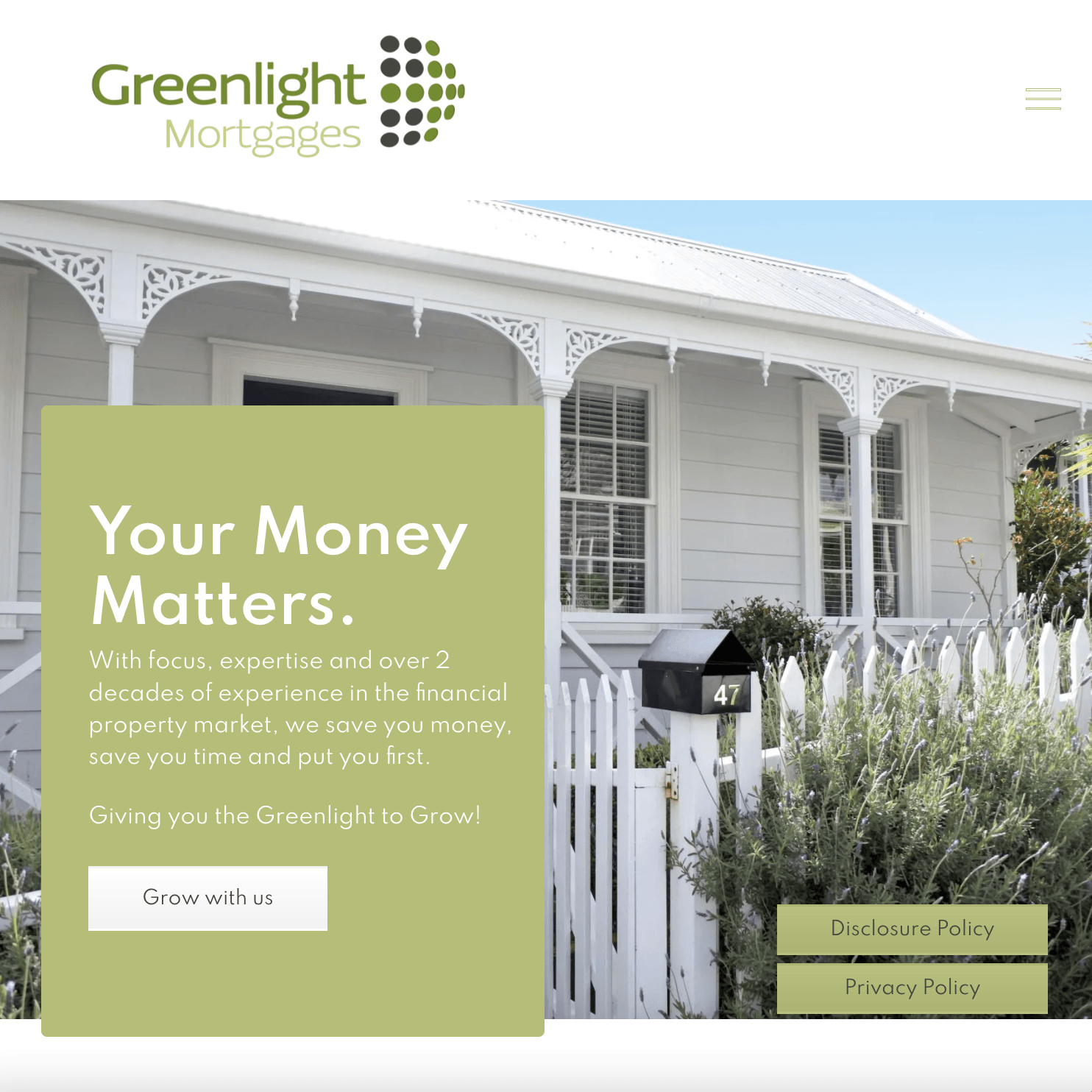 the website for greenlight mortgages shows a white house with a white picket fence .