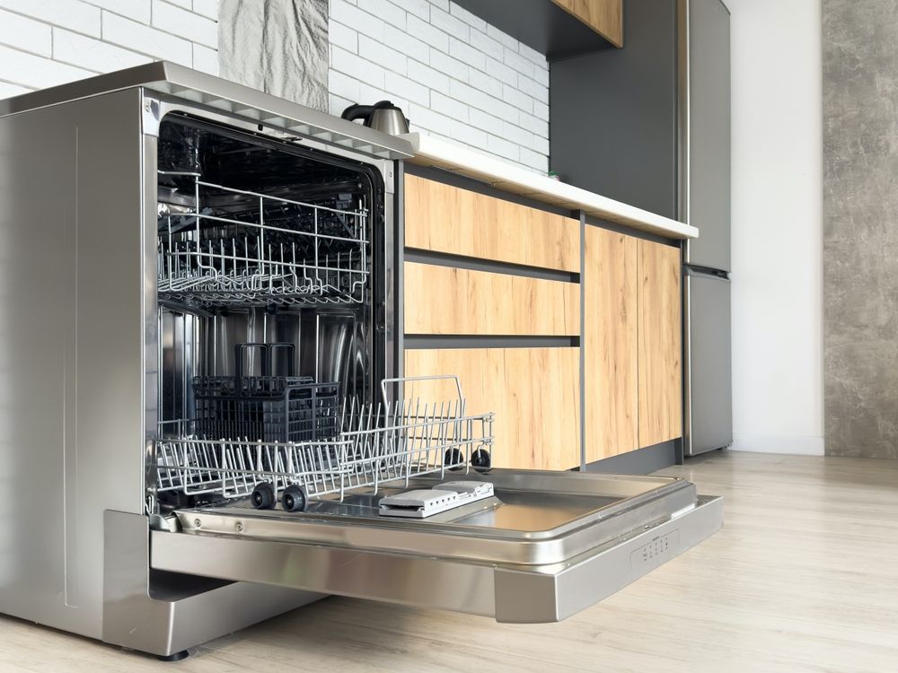 A Dishwasher Is Open In A Kitchen With The Door Open — Tweed Heads Appliance Parts & Repairs In Tweed Heads, NSW