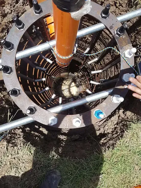 A Person is Working on a Machine in the Dirt — J.A.F. Electrical Solutions in Kawana, QLD