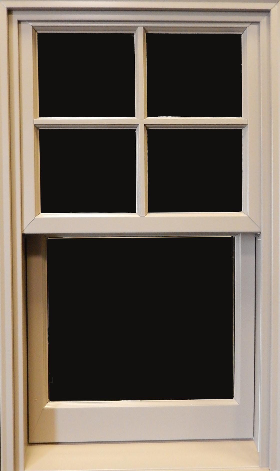 White framed window with four small upper panes and a larger lower pane