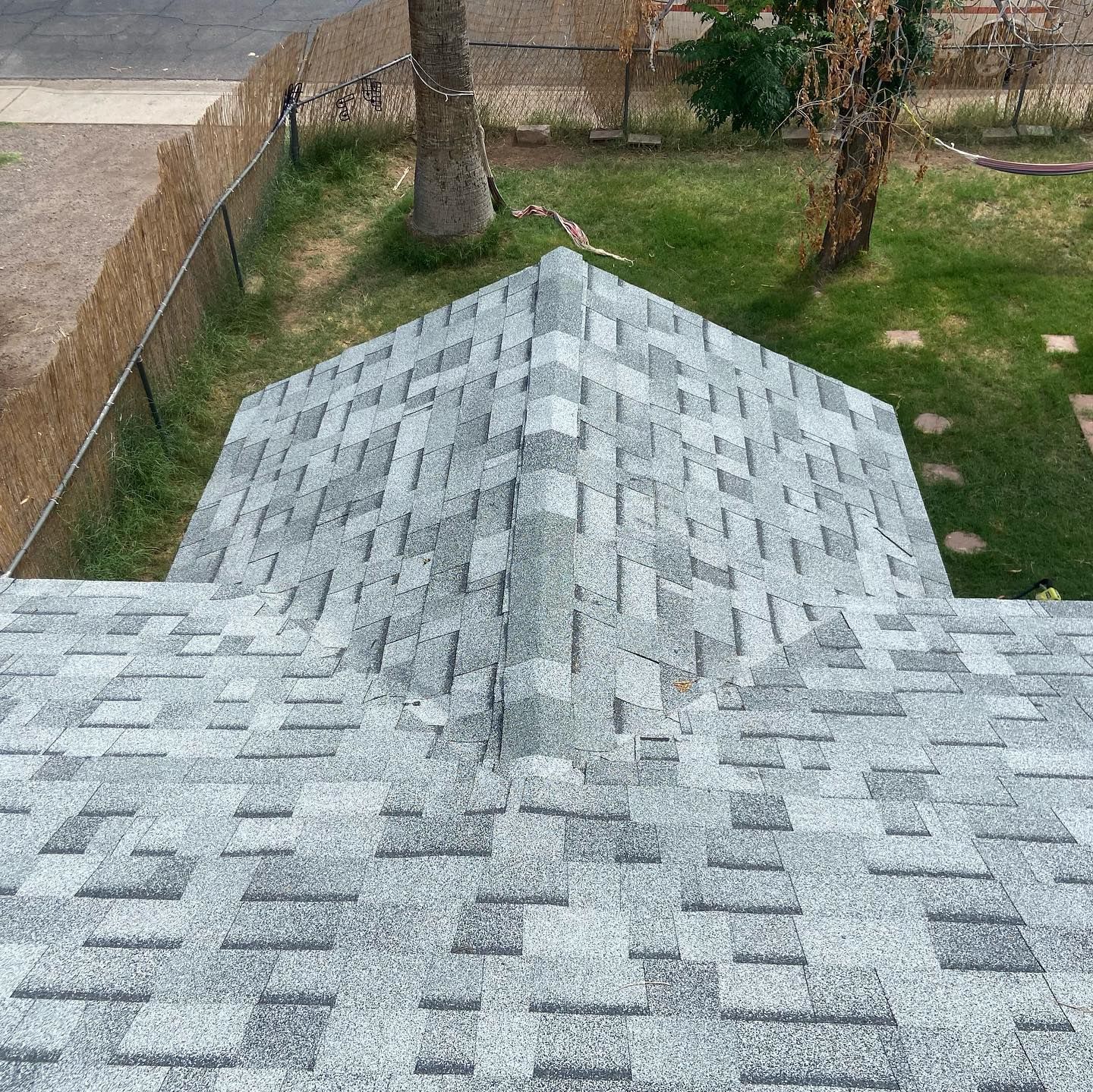 Gray and white asphalt shingle roof.