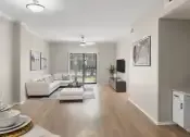 Thumbnail 4 of 27 - Open living room with breakfast bar and built-in desk