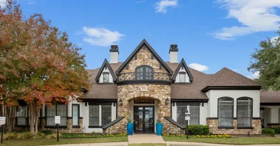 Villas of Vista Ridge Leasing Center, surrounded by trees