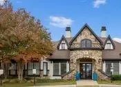 Thumbnail 27 of 27 - Villas of Vista Ridge Leasing Center, surrounded by trees