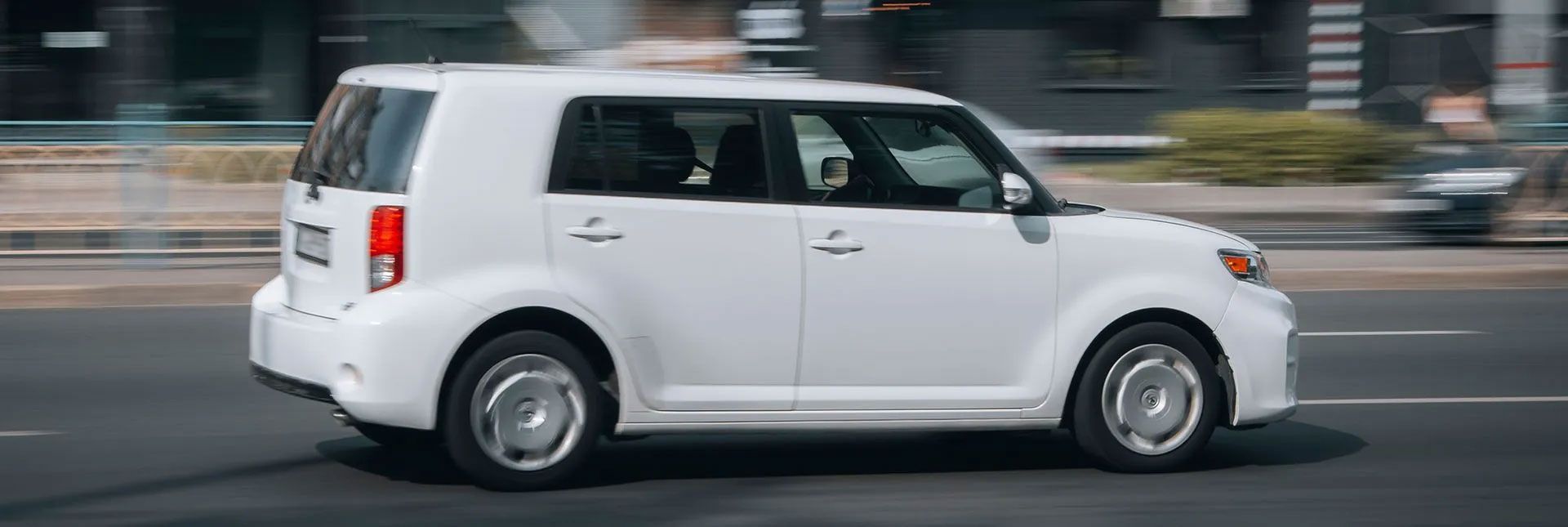 white car on a road | Berkeley Minicar