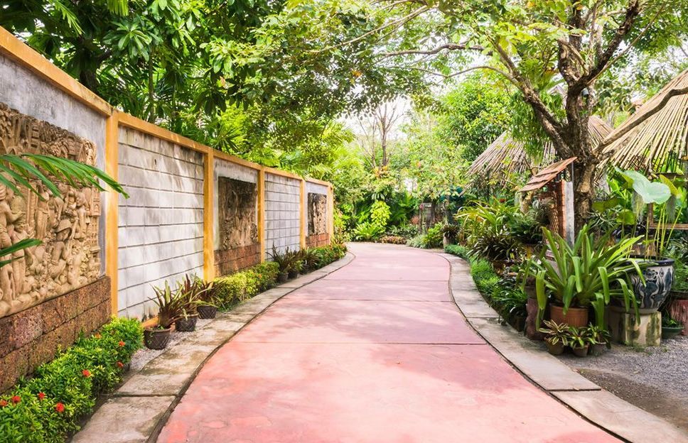 A Red Path Going Through a Lush Green Garden — Small Batch Concrete Delivery in Tweed, NSW