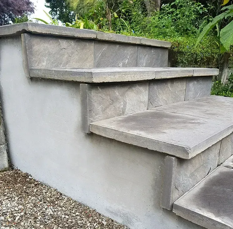 A Set of Stairs Leading Up to a Gravel Driveway — Small Batch Concrete Delivery in Carrara, QLD