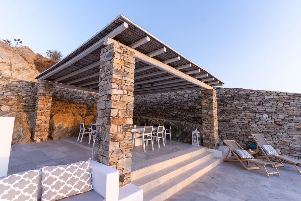 There is a Pergola With Tables and Chairs Underneath It — Small Batch Concrete Delivery in Gold Coast, QLD