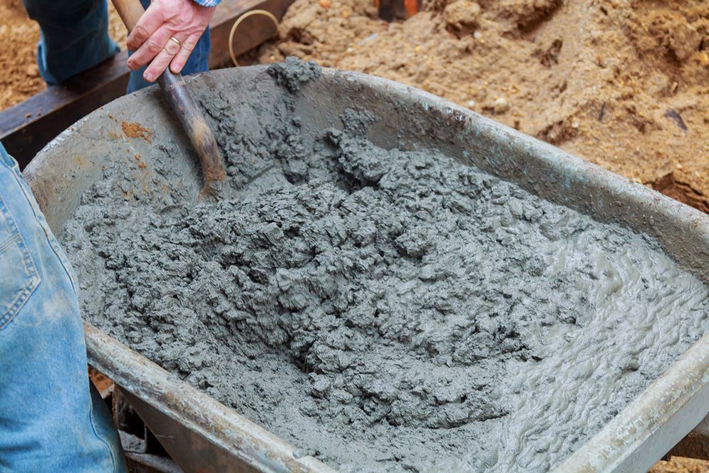 Mixing concrete in a wheelbarrow