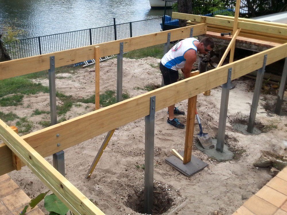 Man Pouring Cement — Small Batch Concrete Delivery in Carrara, QLD