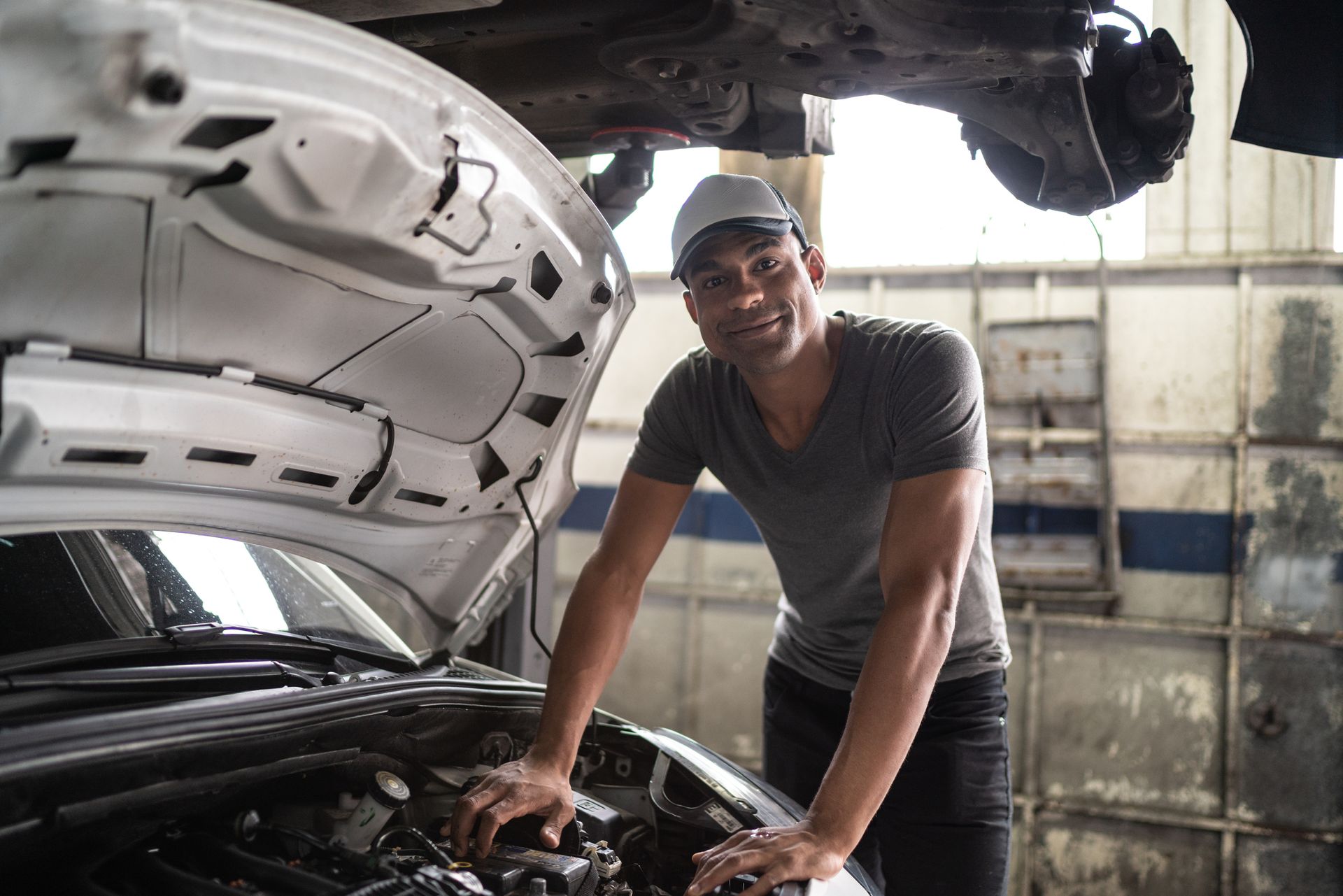 Woman smiling while looking at something — West Grove, PA — Registra Tu Negocio Ya