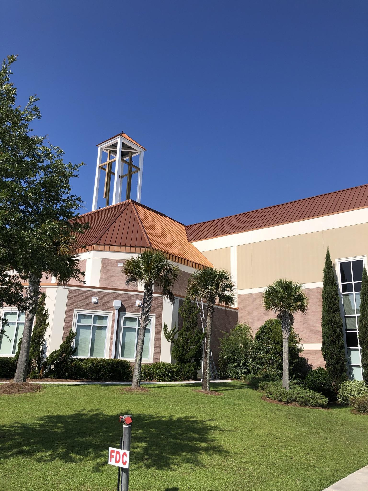 A large building with a bell tower on top of it