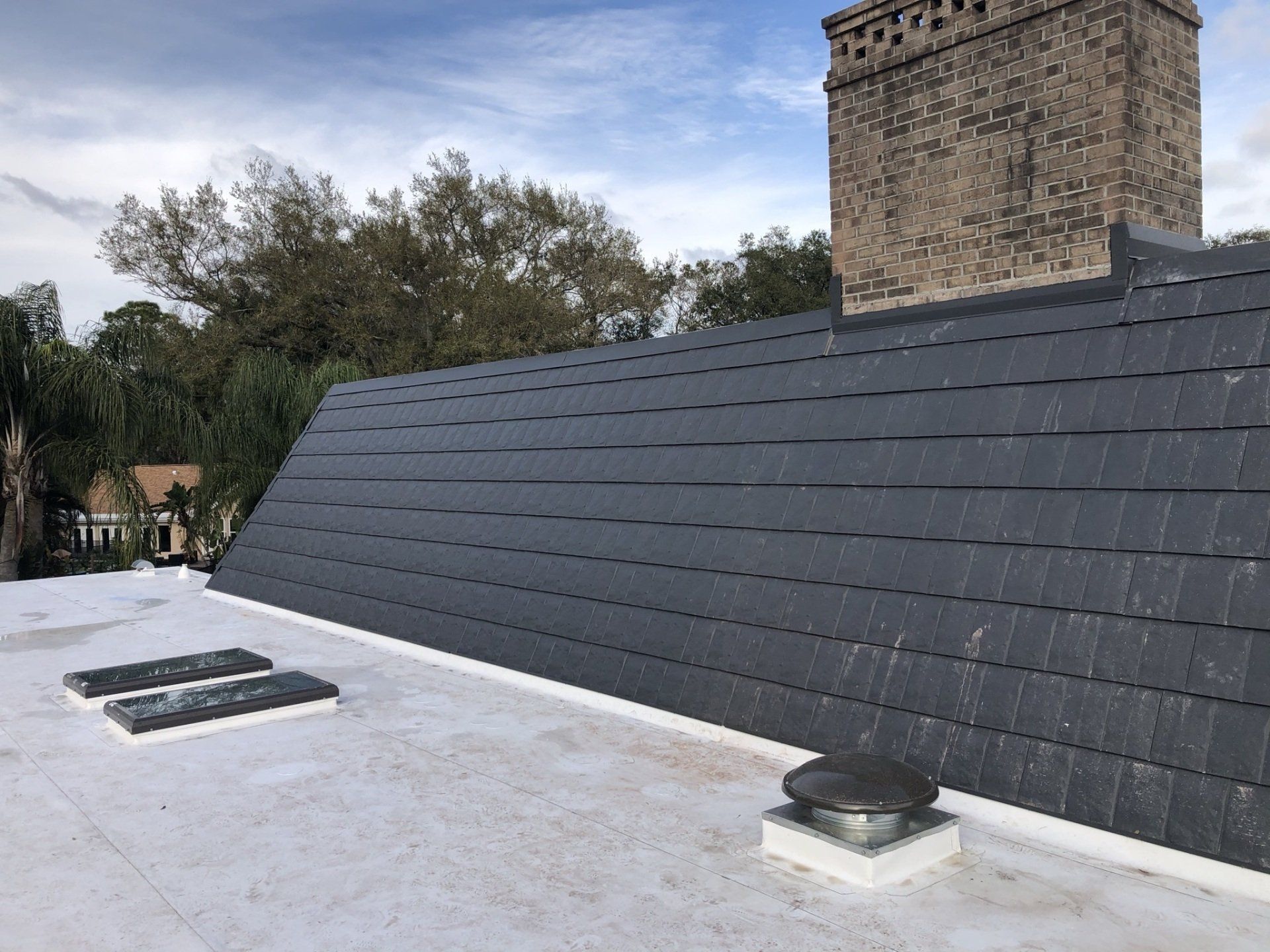 A roof with a chimney on top of it