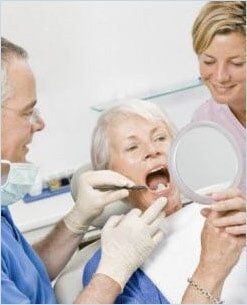 Patient Looking at Her Teeth — Medicaid in Yakima, WA