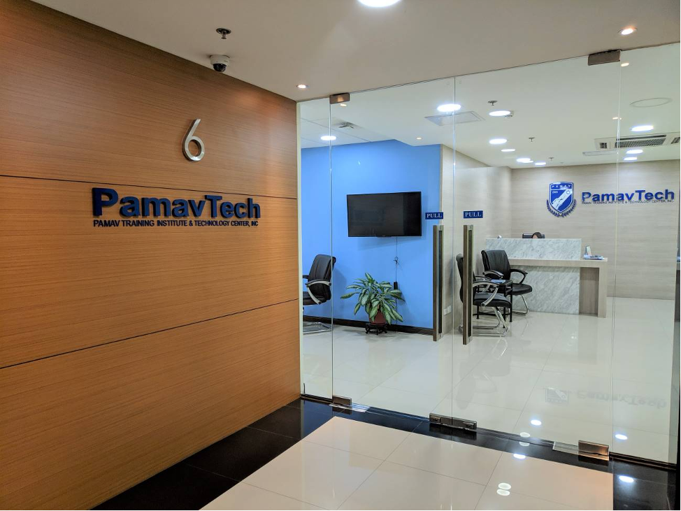 A room with a glass door and a sign that says pamavtech