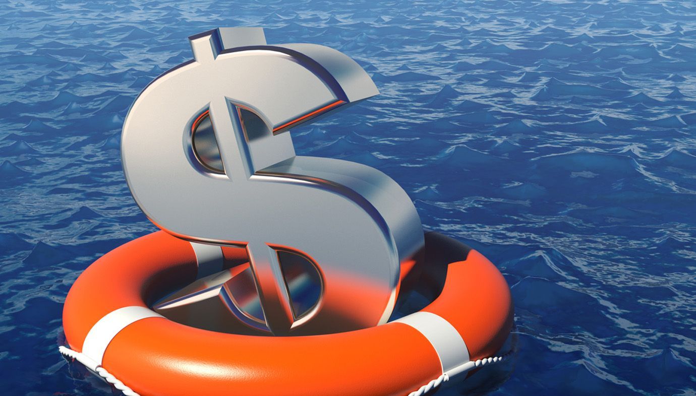 A dollar sign is floating on top of an orange life preserver in the ocean