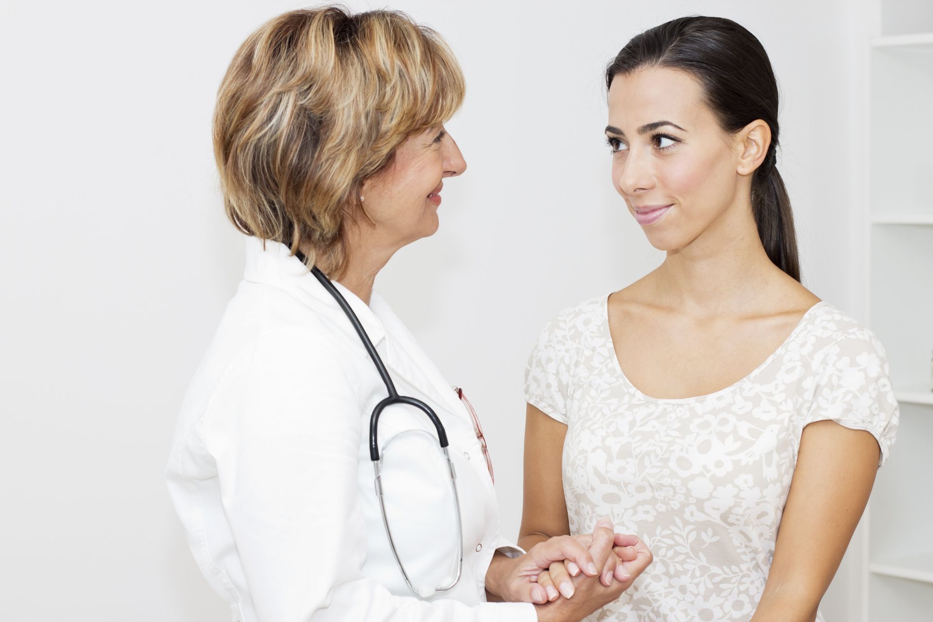 Patient Consulting with Female Physician