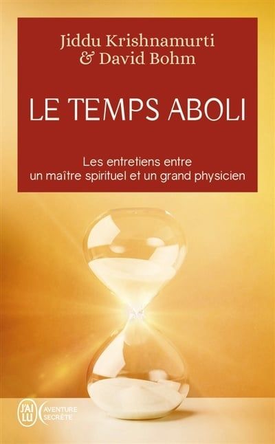 Couverture du livre : « Le Temps Aboli », ornée d’un sablier, dans des tons rouges et or. Illustrations de Jiddu Krishnamurti et David Bohm.