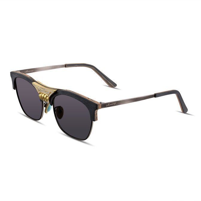 A pair of sunglasses with a black frame and gold trim on a white background.
