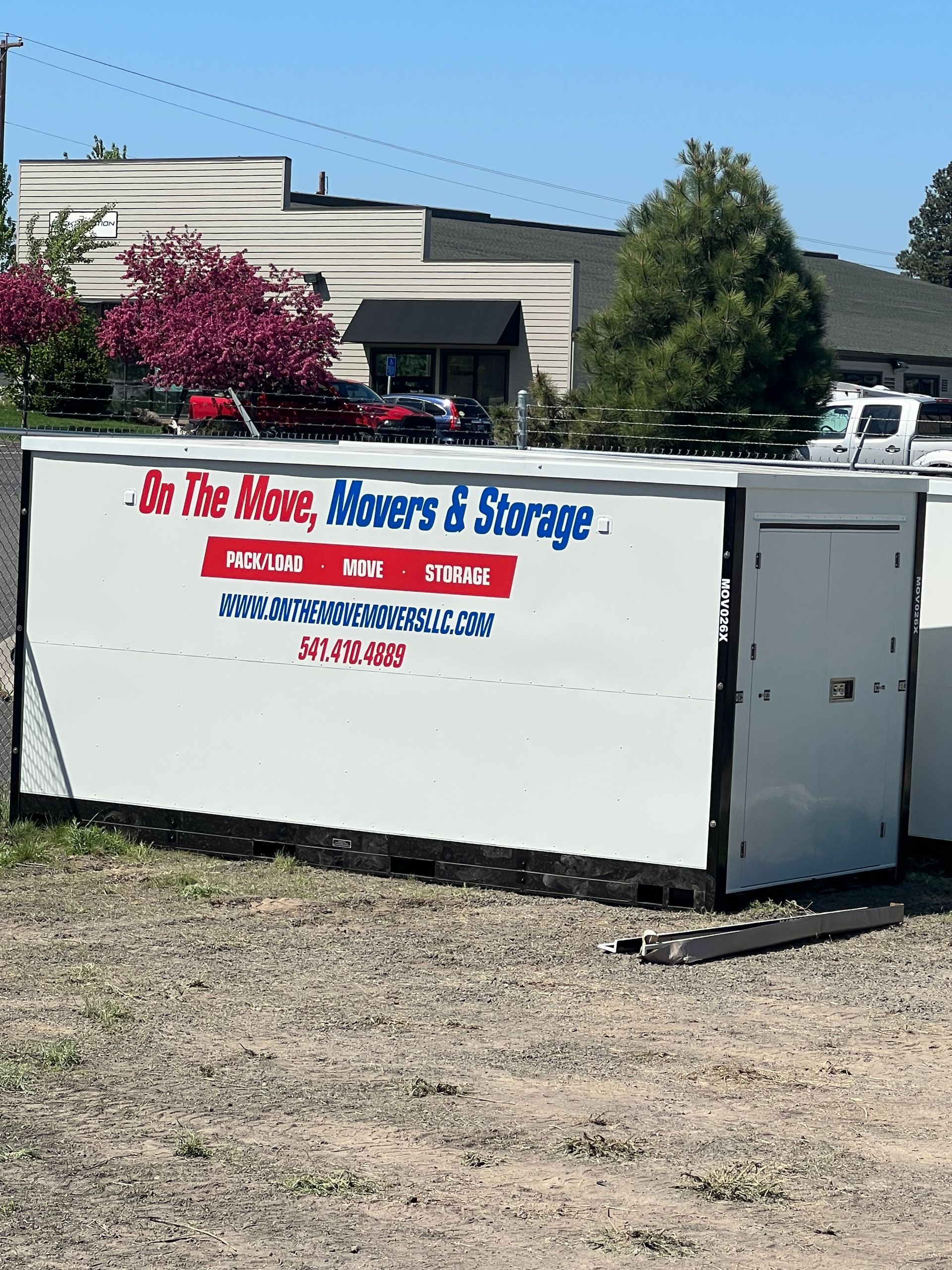 Residential Moving — Two Men Carrying a Box in Bend, OR