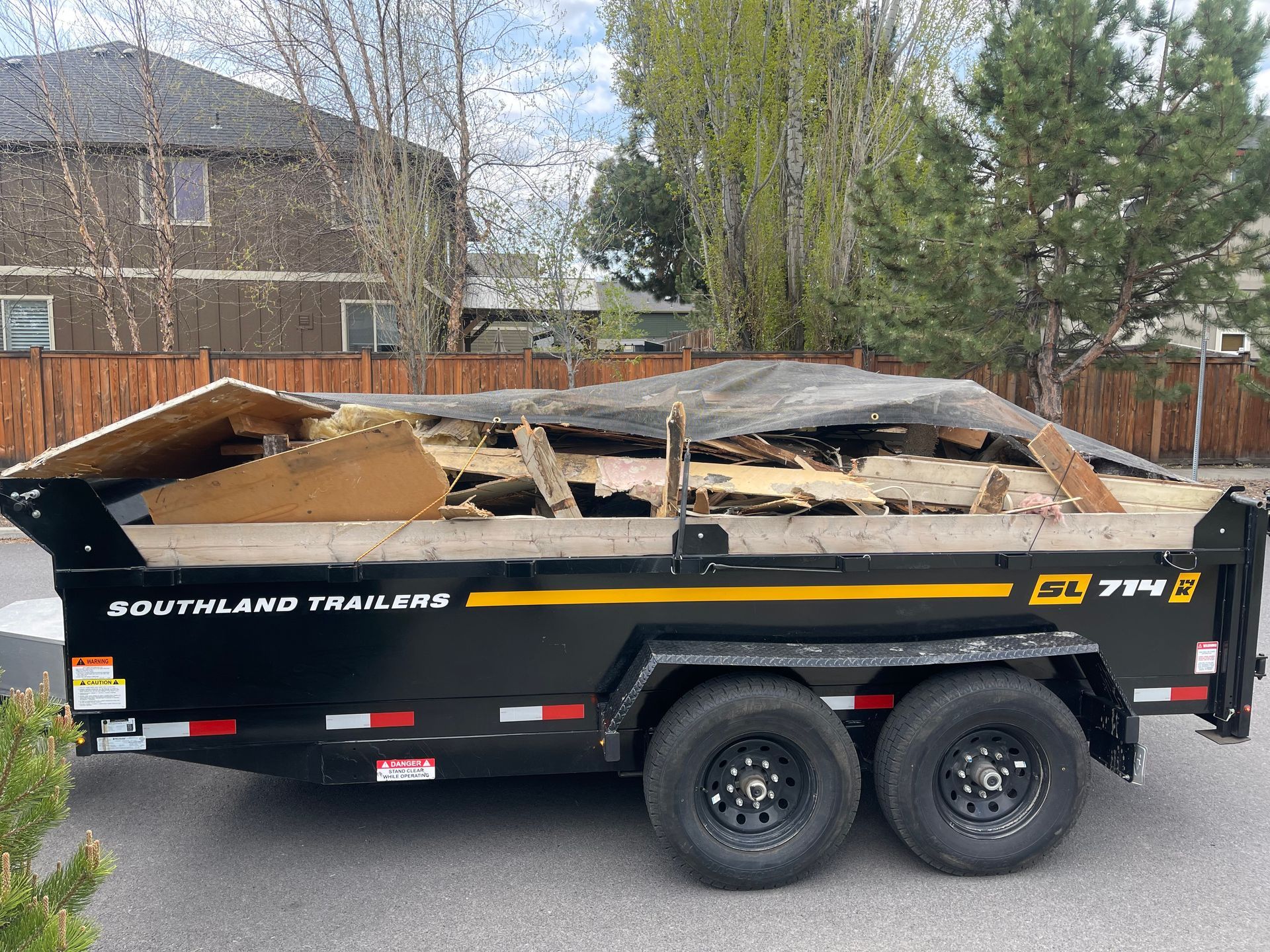 Blue Dumpster Truck — Bend, OR — On The Move, Movers Moving Company LLC.