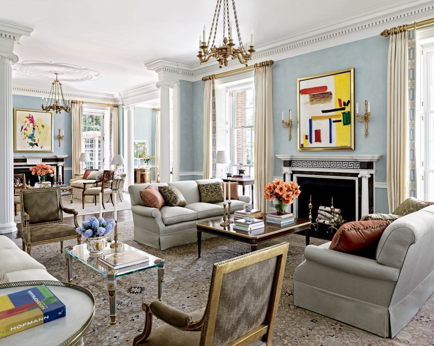 a living room filled with furniture and a fireplace