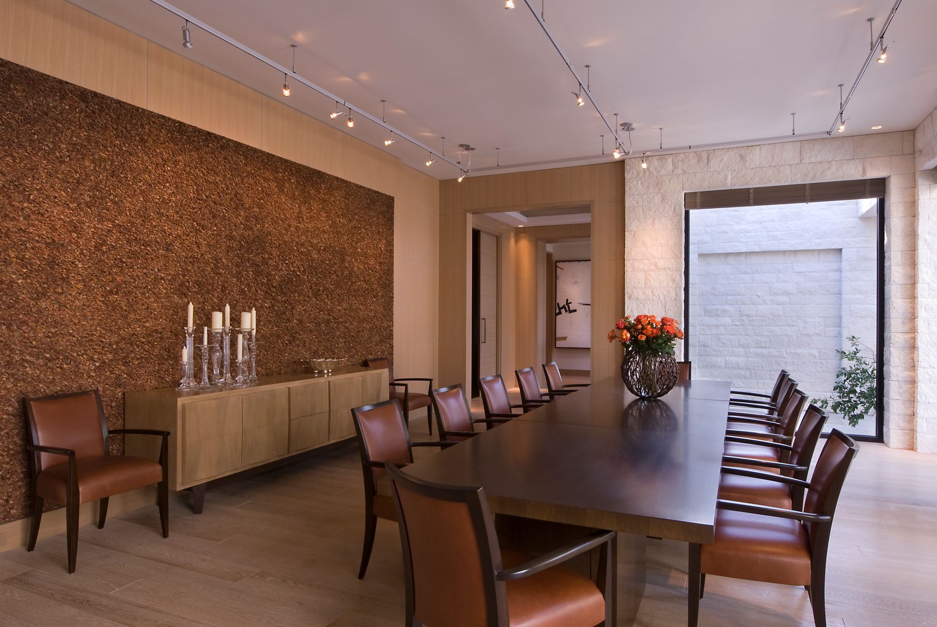 a dining room with a long table and chairs