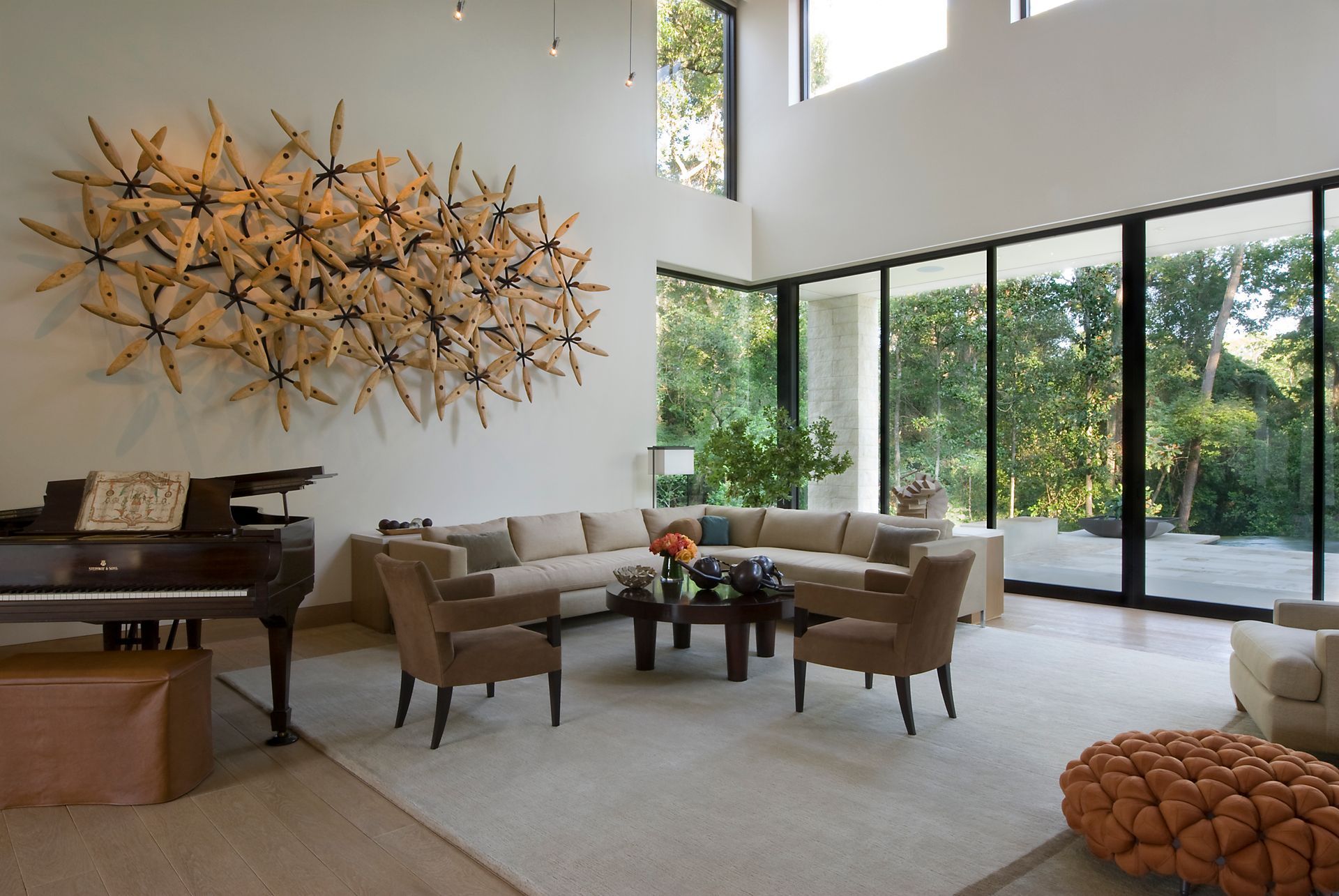 a living room with a piano and a couch