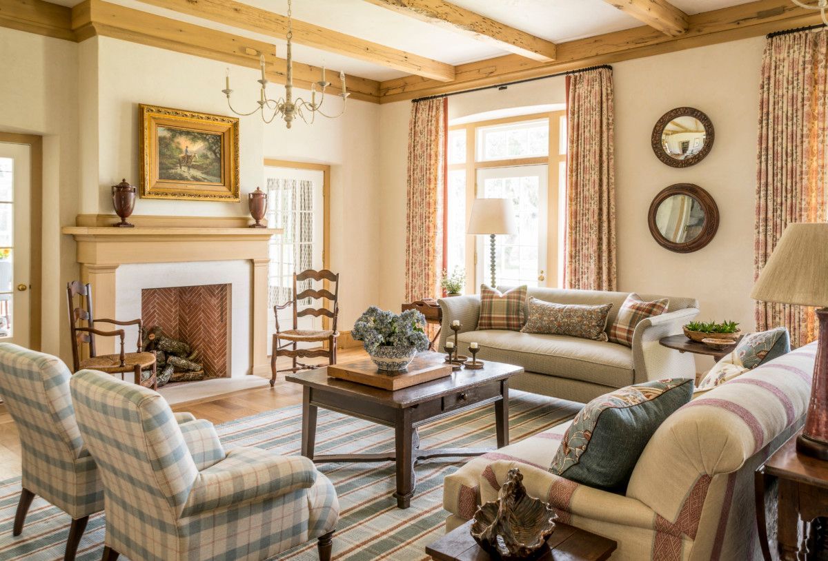 a living room filled with furniture and a fireplace .