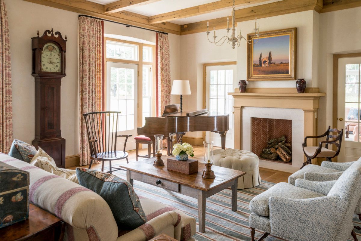 a living room filled with furniture and a fireplace .