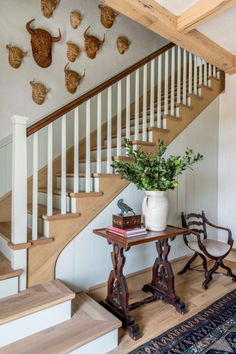 a wooden staircase with a table in front of it