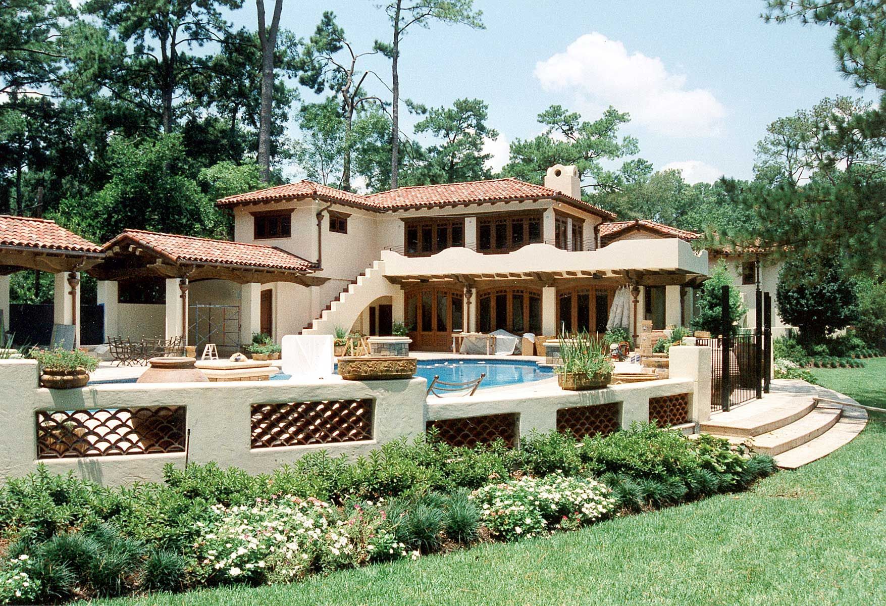 a large house with a pool in the backyard