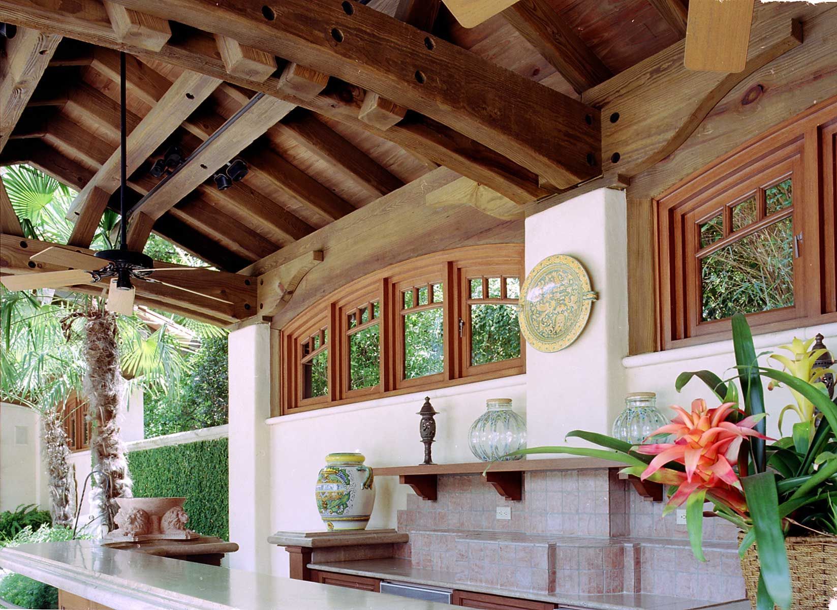 a kitchen with a wooden ceiling and a stainless steel counter top