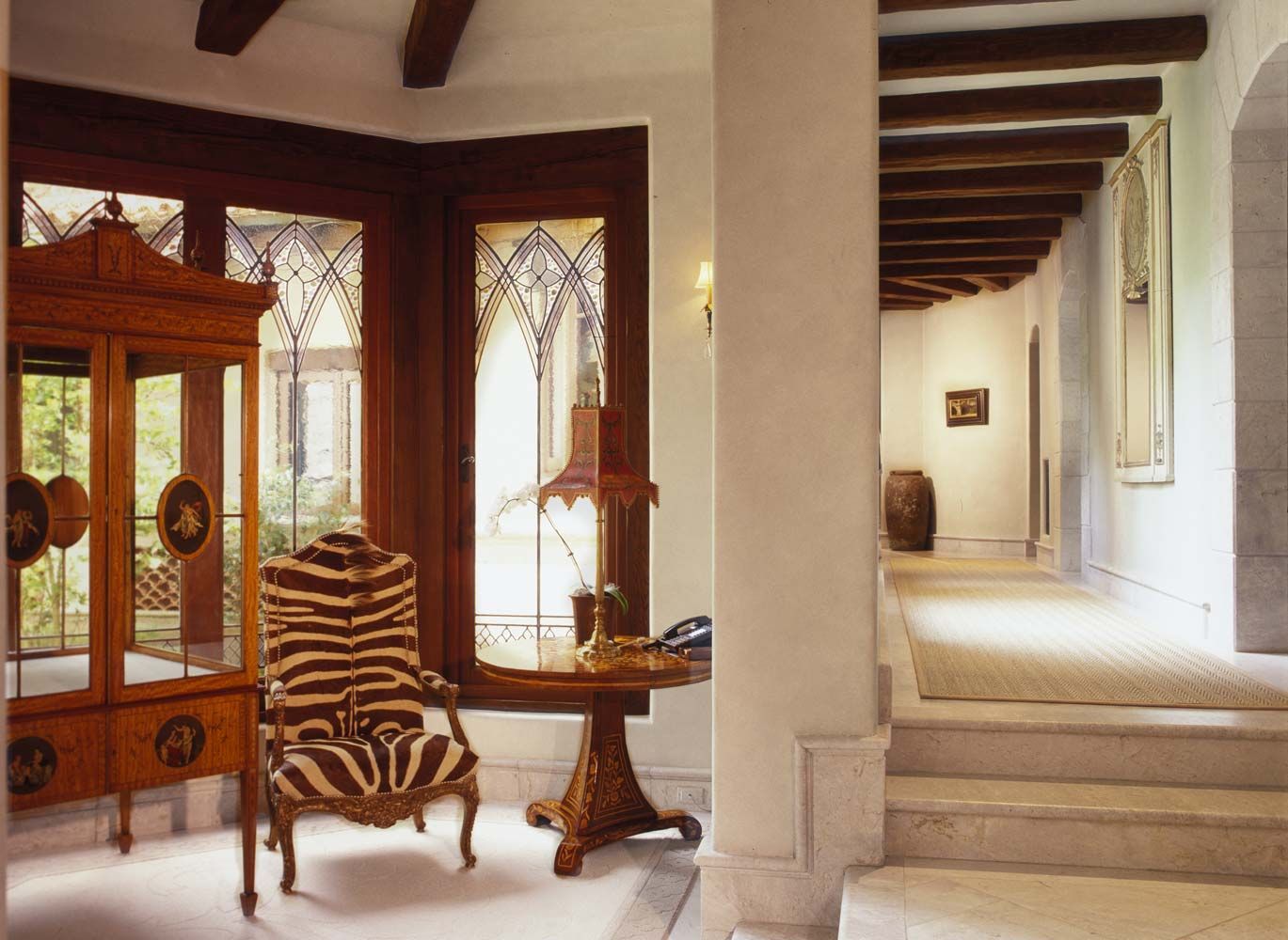 a room with a zebra print chair and a table