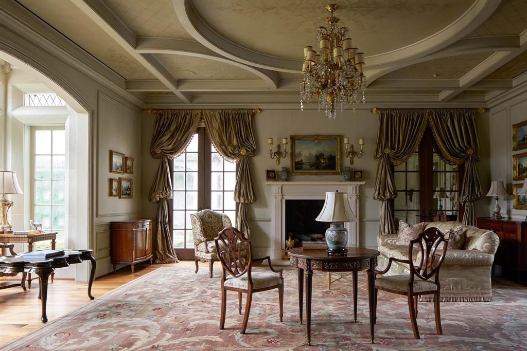 a living room filled with furniture and a fireplace